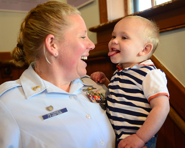 Coast guard woman with baby